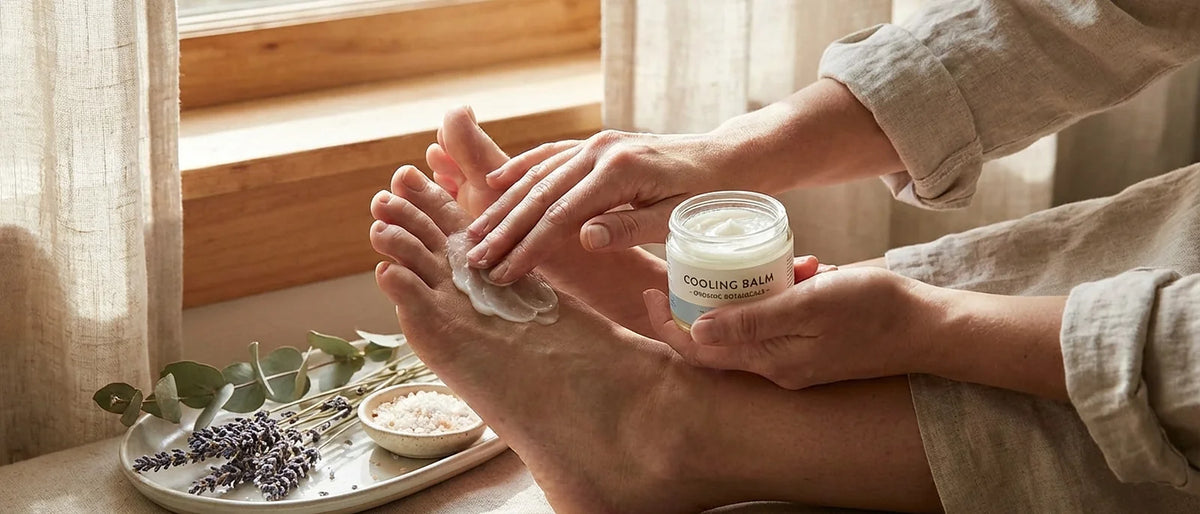 Person receiving soothing foot massage with natural cooling balm for pain relief after long day