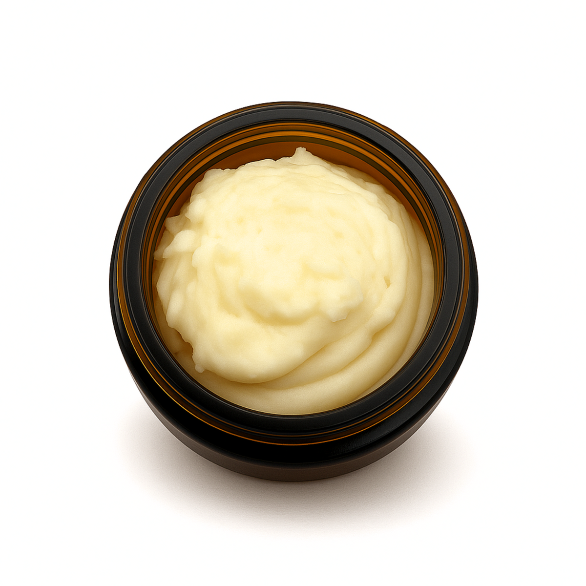 Top-down view of an open amber glass jar filled with creamy whipped balm, showcasing the soft texture of beef tallow for face care on a clean white background with a subtle shadow.